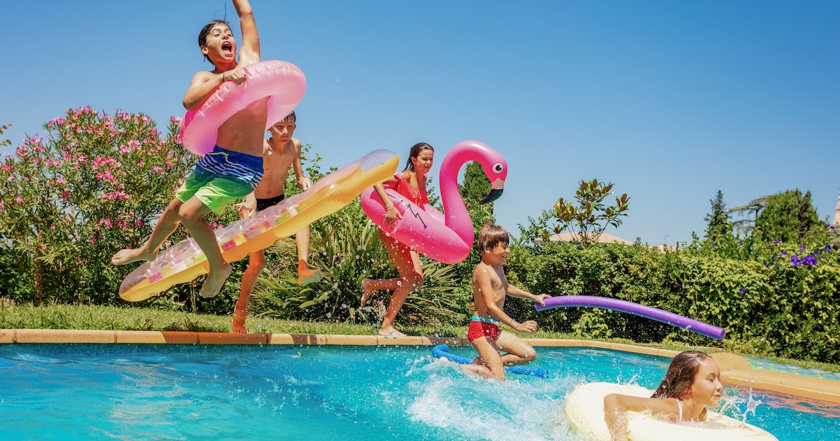 Kids jumping into pool